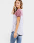 Woman wearing a two-tone shirt with a white background