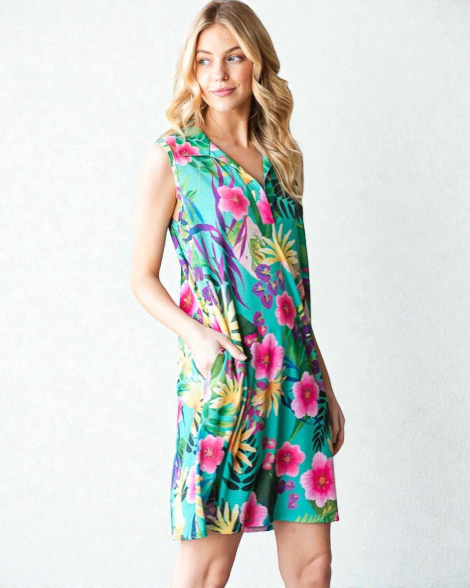 Woman wearing a colorful floral dress on a white background