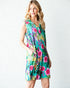 Woman wearing a colorful floral dress on a white background