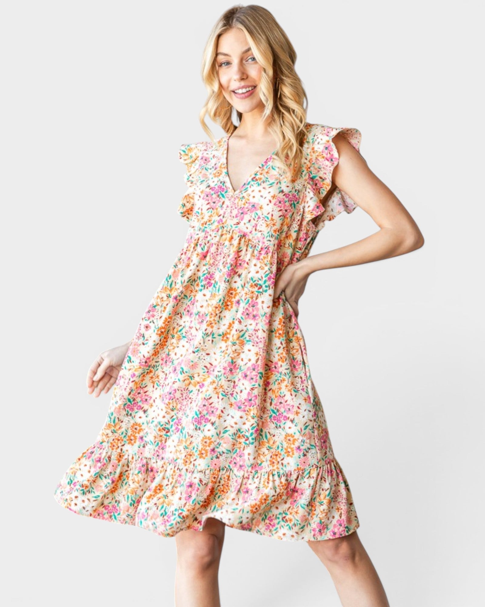 Woman wearing a floral dress on a white background