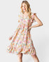 Woman wearing a floral dress on a white background