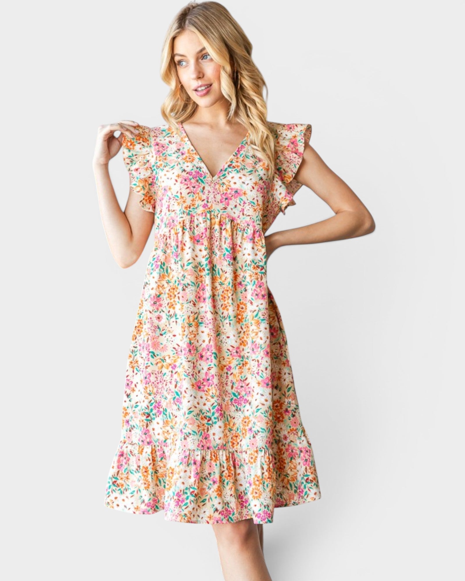 Woman wearing a floral dress on a white background