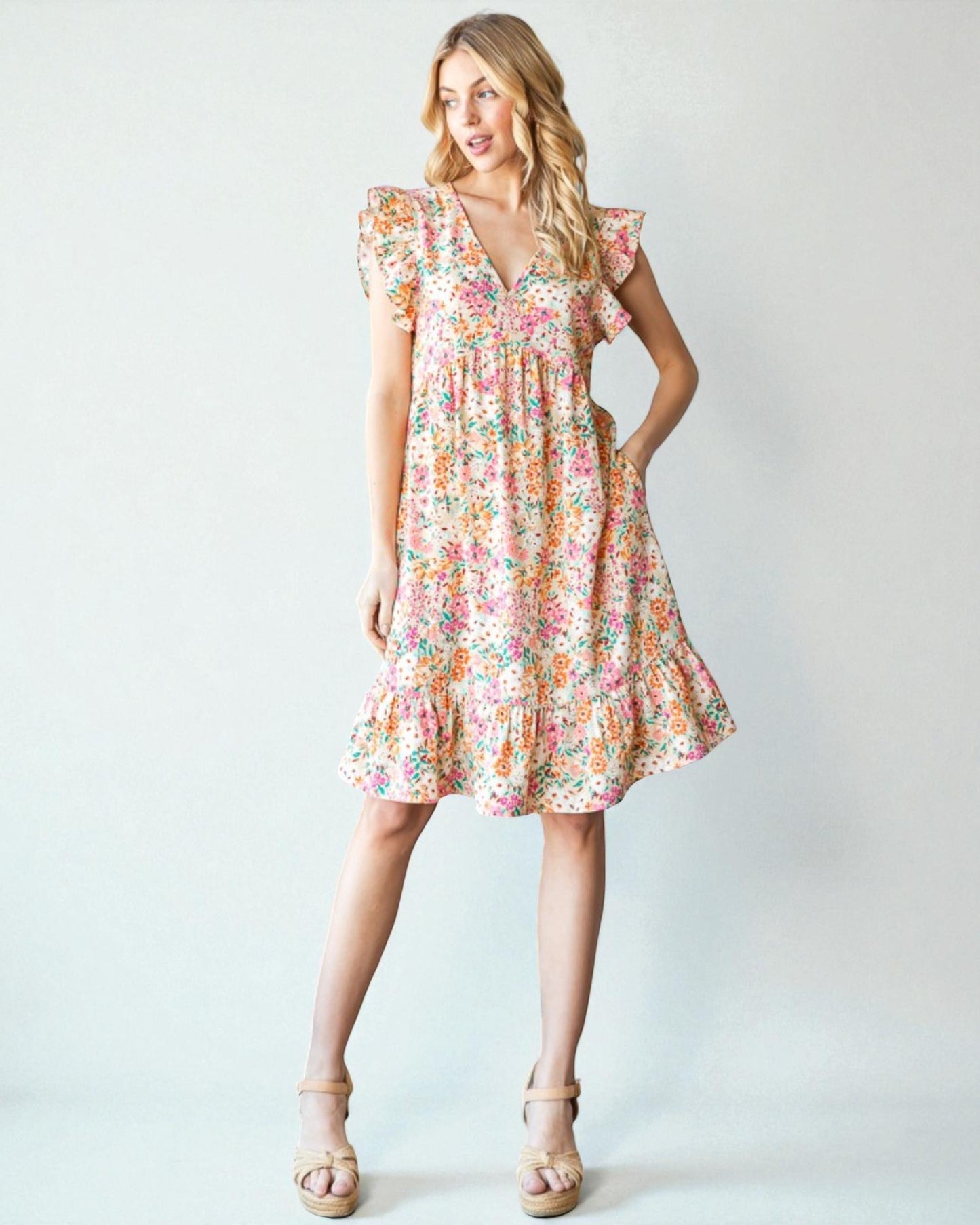 Woman wearing a floral dress on a white background