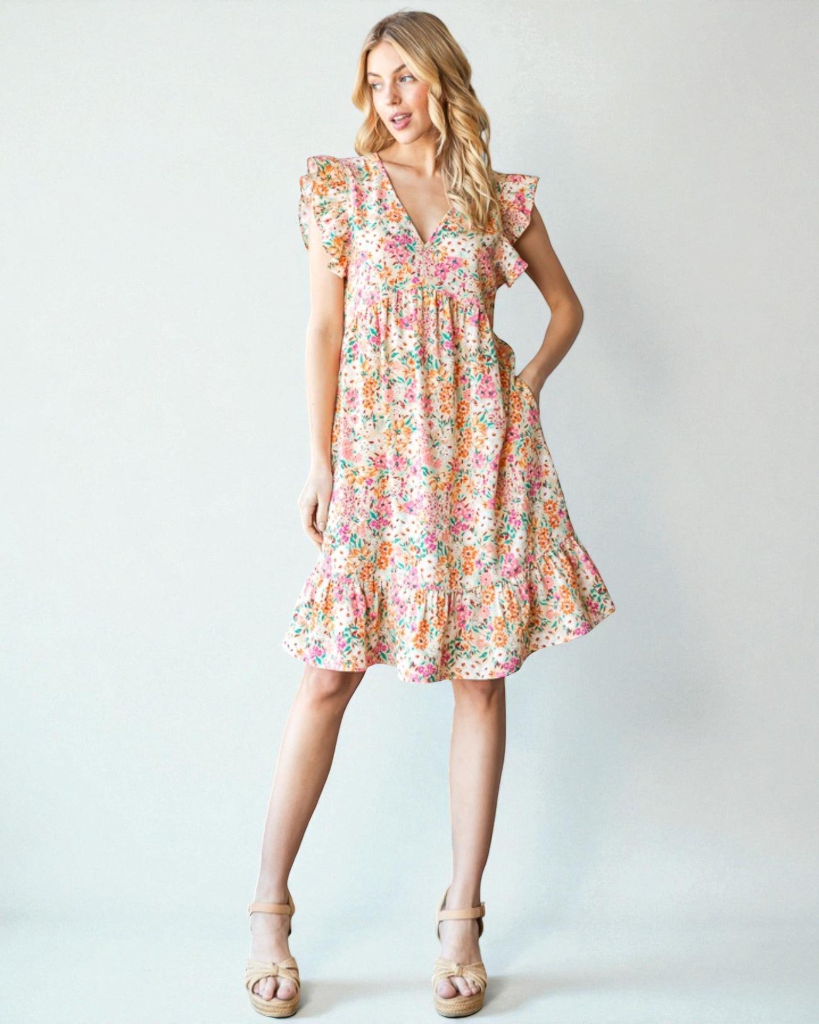 Woman wearing a floral dress on a white background