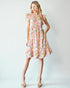 Woman wearing a floral dress on a white background
