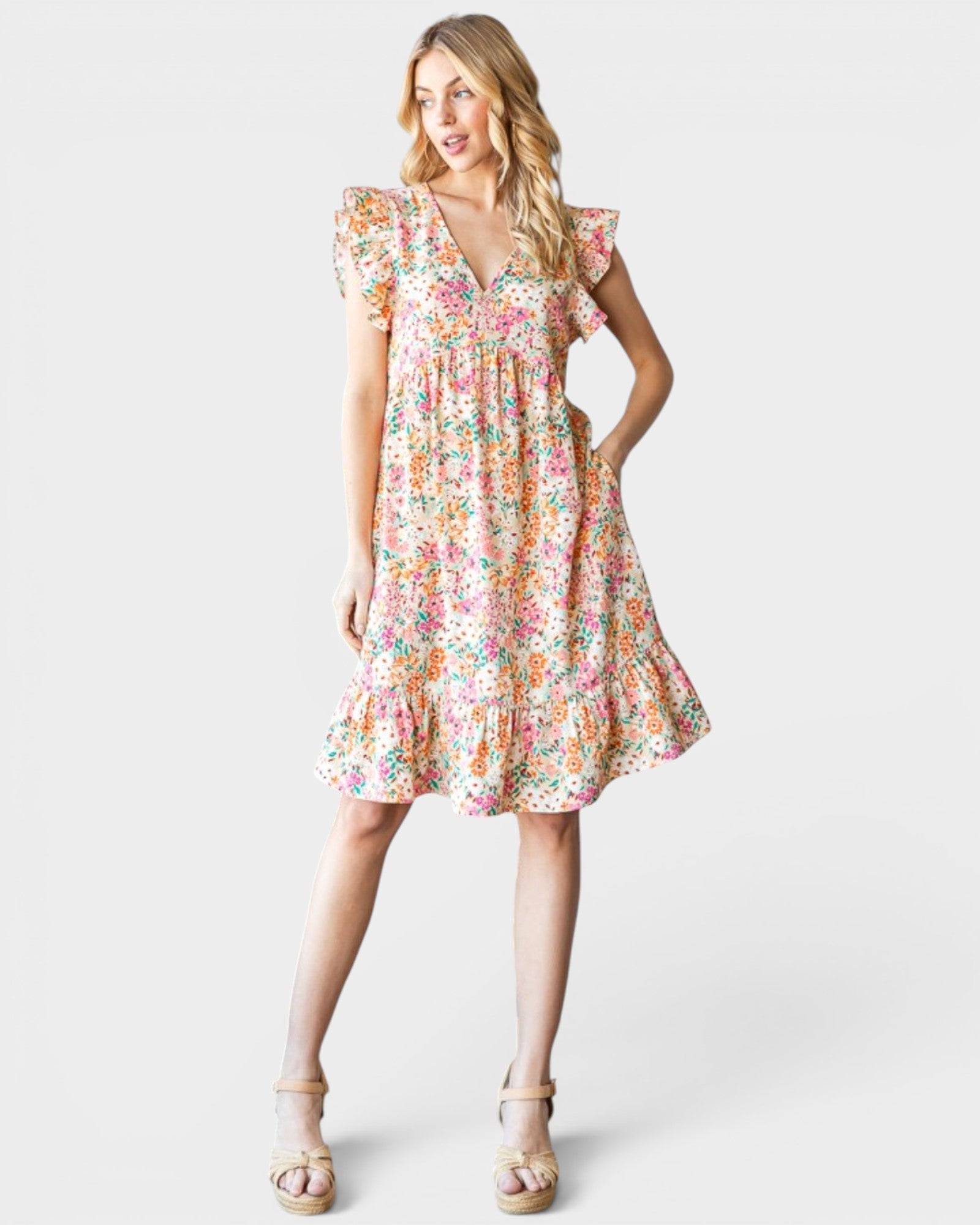 Woman wearing a floral dress on a white background