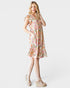 Woman wearing a floral dress on a white background