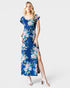 Woman wearing a blue floral dress on a white background