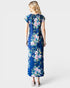 Woman wearing a blue floral dress on a white background