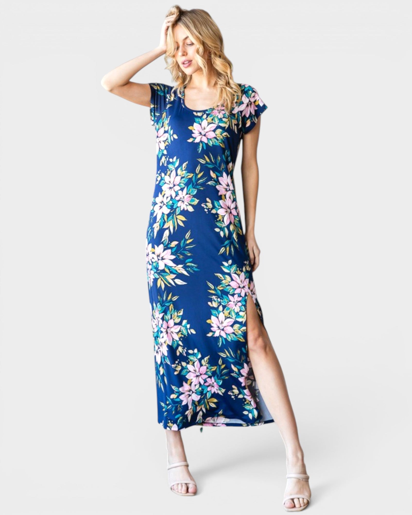 Woman wearing a blue floral dress on a white background