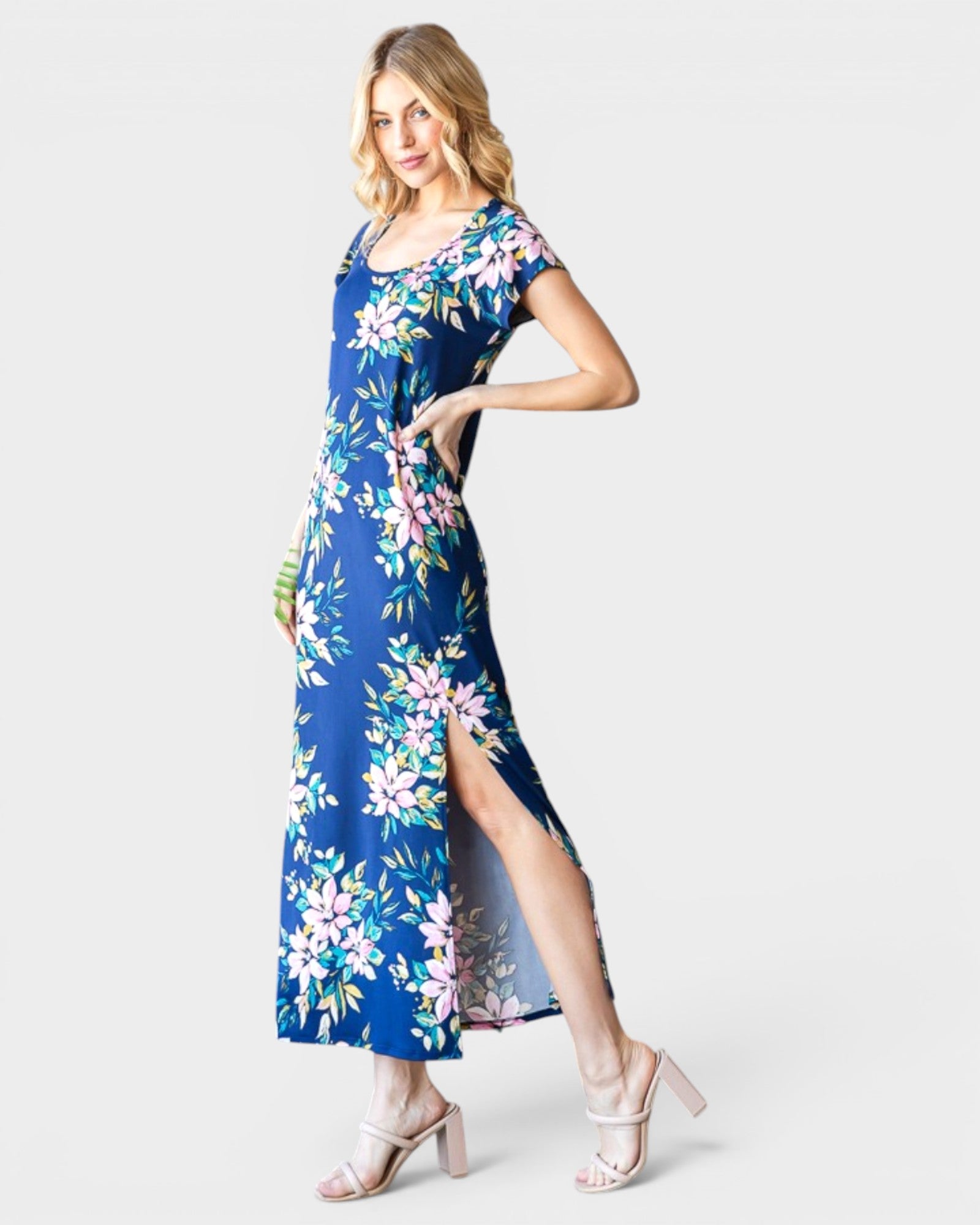 Woman wearing a blue floral dress on a white background