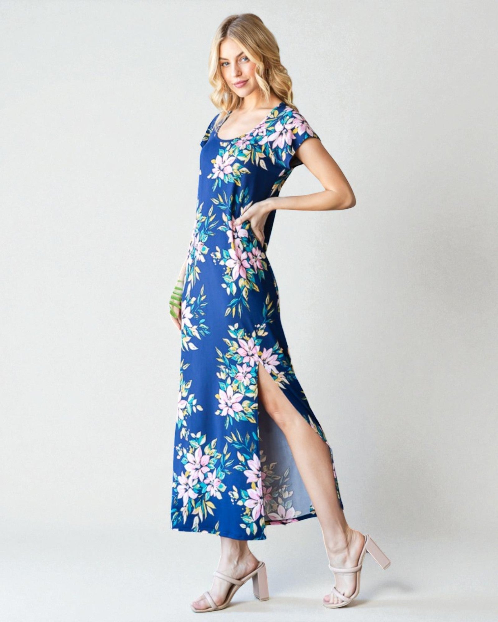 Woman wearing a blue floral dress on a white background