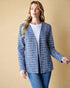 Woman wearing a blue checkered jacket against a beige background
