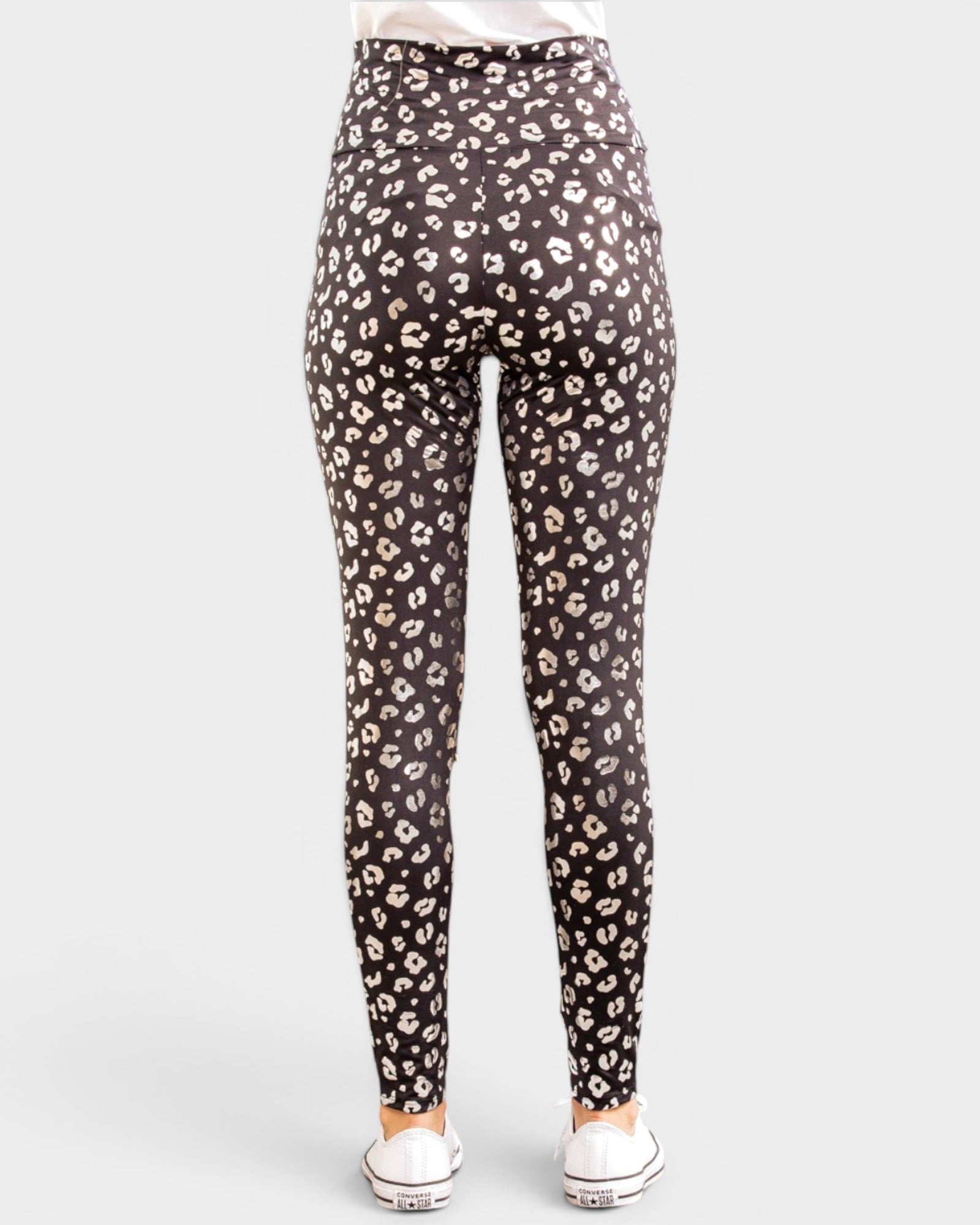 Black leggings with a leopard print pattern on a white background