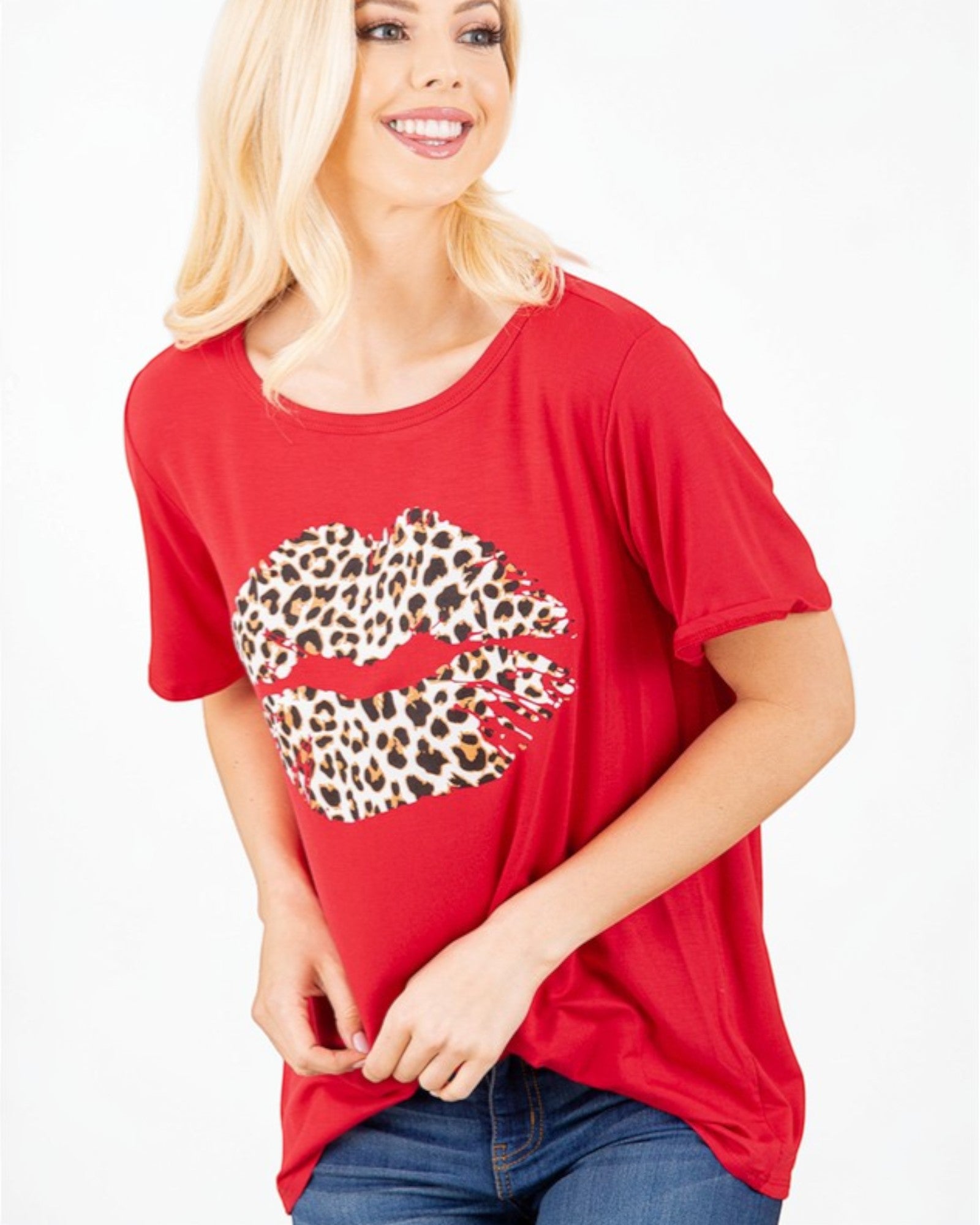 Woman wearing a red t-shirt with a leopard print lip design on a white background