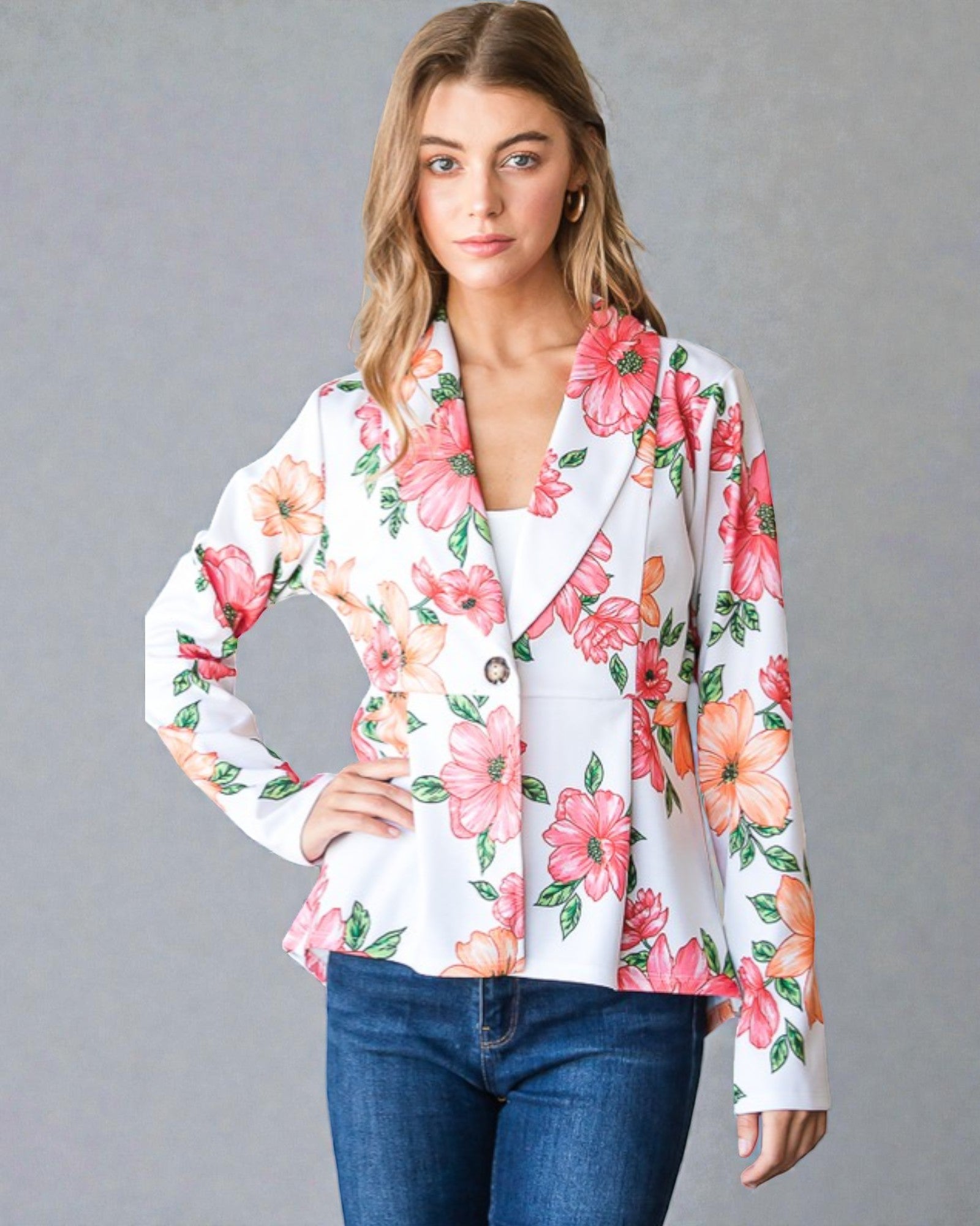 Woman wearing a floral blouse with a gray background