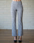 Plaid pants worn by a person against a neutral background