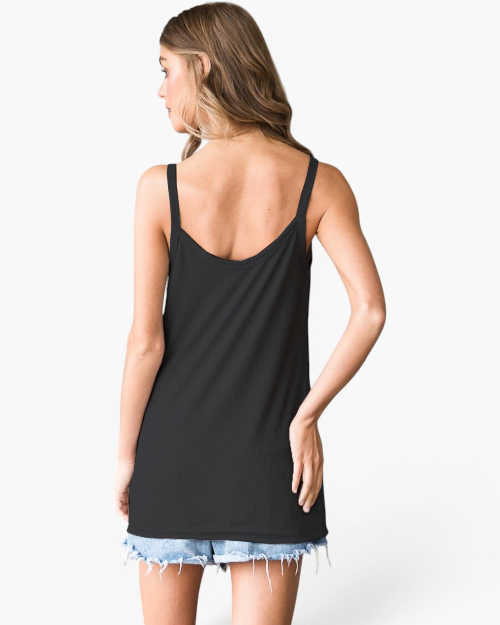 A woman shown from the back wearing a black sleeveless tank top and light blue denim cutoff shorts against a plain white studio background.