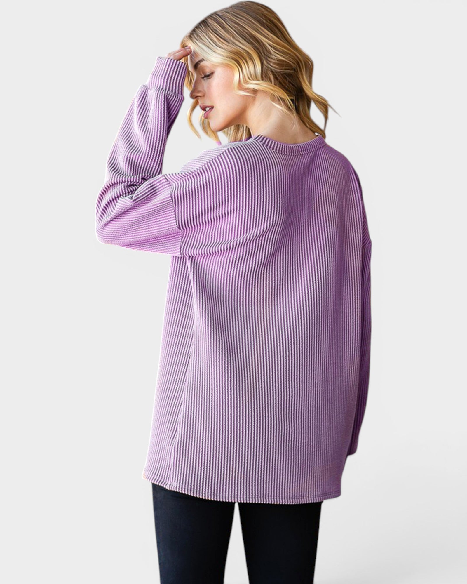 Woman wearing a purple striped shirt on a white background