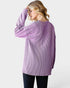 Woman wearing a purple striped shirt on a white background