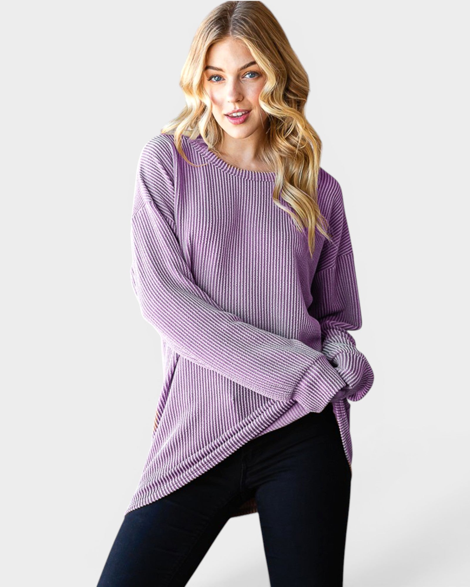 Woman wearing a purple sweater on a white background