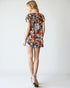 Woman wearing a floral dress on a white background