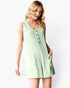 A woman modeling a sleeveless mint green ribbed romper with a buttoned neckline and front pockets, set against a plain white studio background.