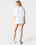 Person wearing a white t-shirt and shorts on a plain background