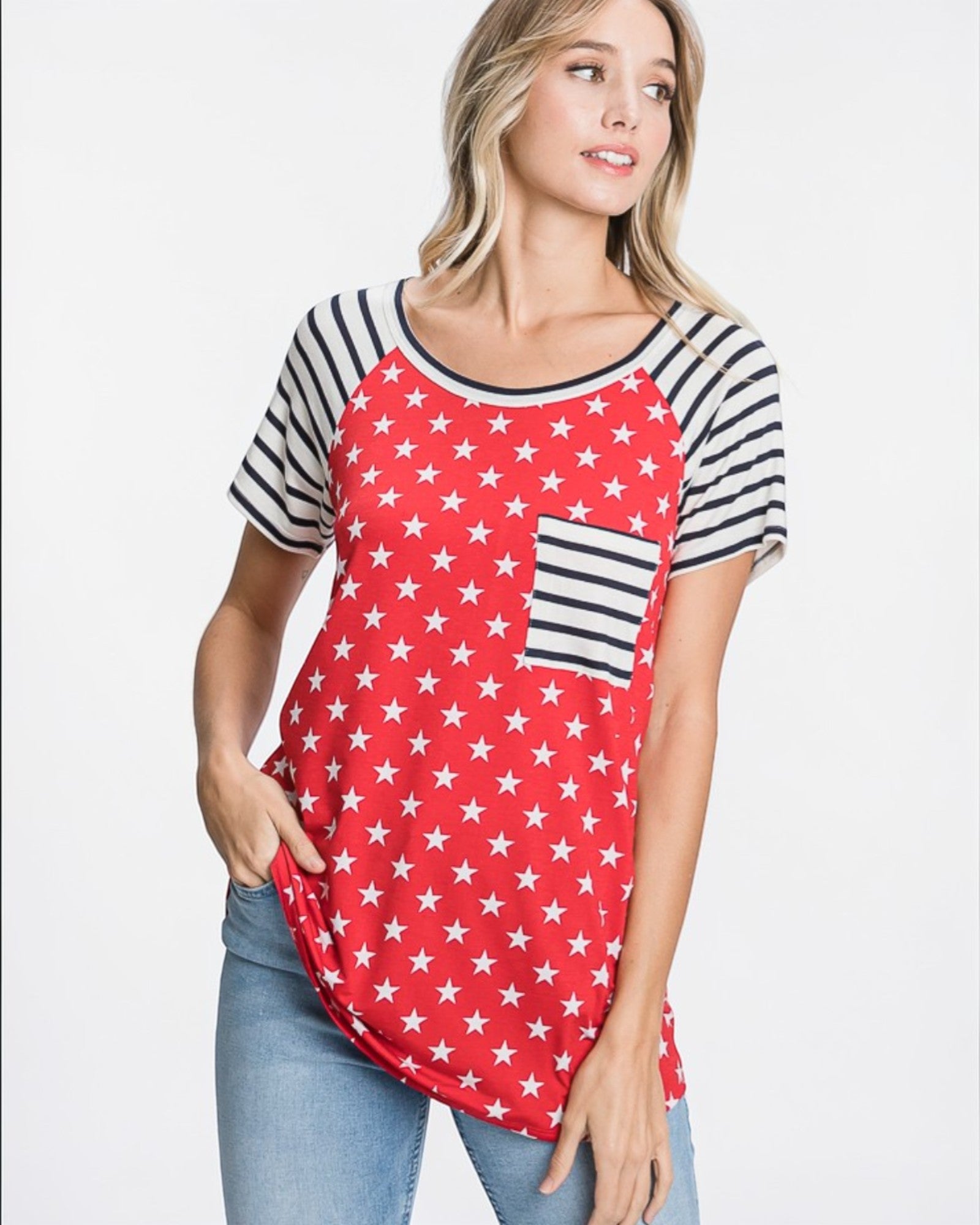 Woman wearing a red baseball-style shirt with white star pattern and black sleeves on a plain background