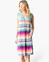 A woman modeling a sleeveless V-neck knit dress with horizontal multicolor stripes in shades of teal, pink, orange, purple, gray, and white, featuring a three-button placket.