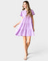 Woman wearing a purple dress on a white background