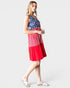Woman wearing a dress with American flag design on a white background