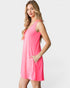 Woman wearing a pink sleeveless dress on a white background