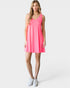 Woman wearing a pink sleeveless dress on a white background