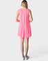 Woman wearing a pink sleeveless dress on a white background