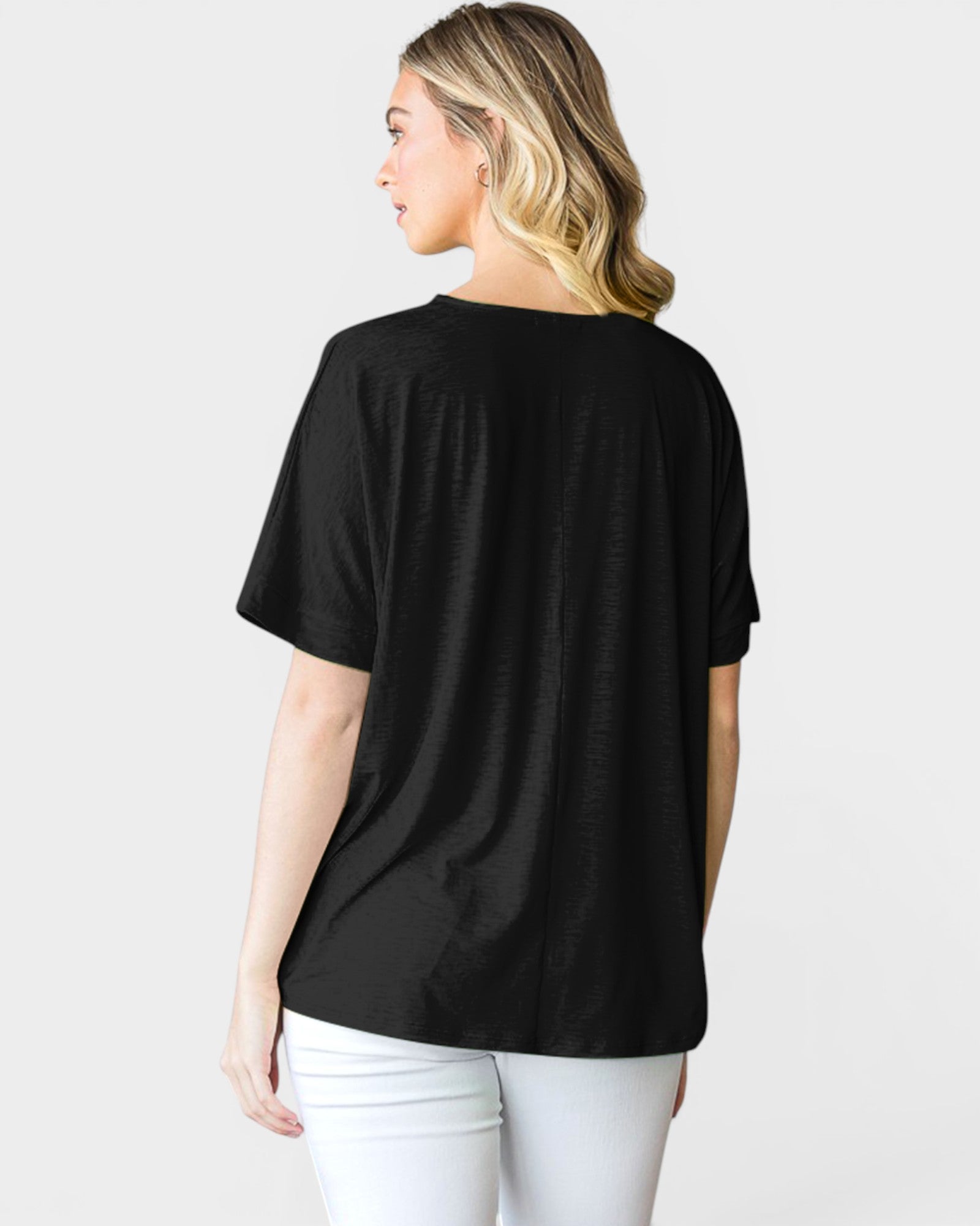 Person wearing a black t-shirt on a white background