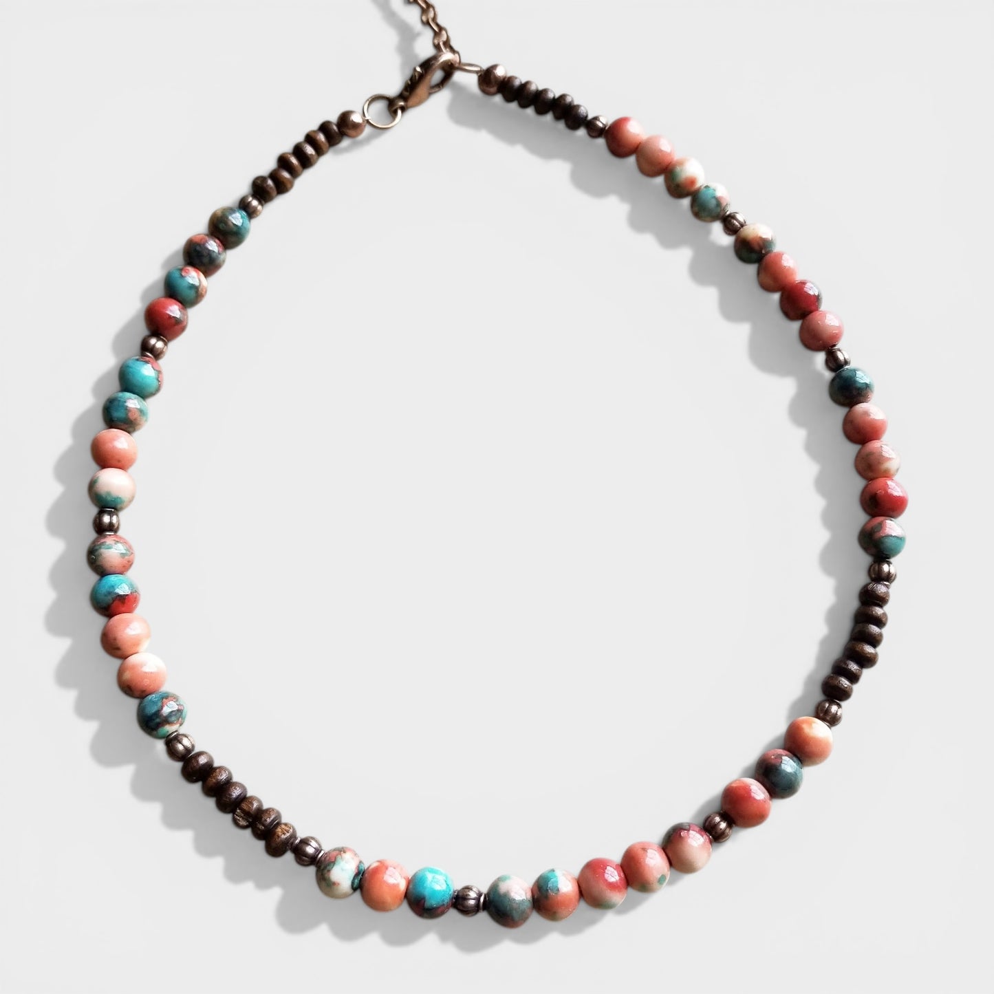 Necklace with multicolored beads on a white background