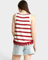 Woman wearing a red and white striped tank top with frayed hem on a plain background