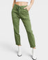 Green pants worn by a person on a white background