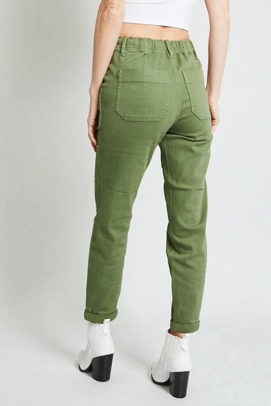 Person wearing green pants on a white background