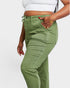 Person wearing green pants on a white background