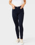Person wearing dark blue jeans on a white background