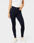 Person wearing dark blue jeans on a white background