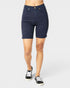Navy blue shorts worn by a person on a white background