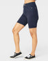 Person wearing navy blue shorts on a white background