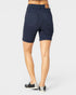 Navy blue shorts worn by a person on a white background