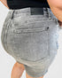Gray denim shorts with a brand label on a white background