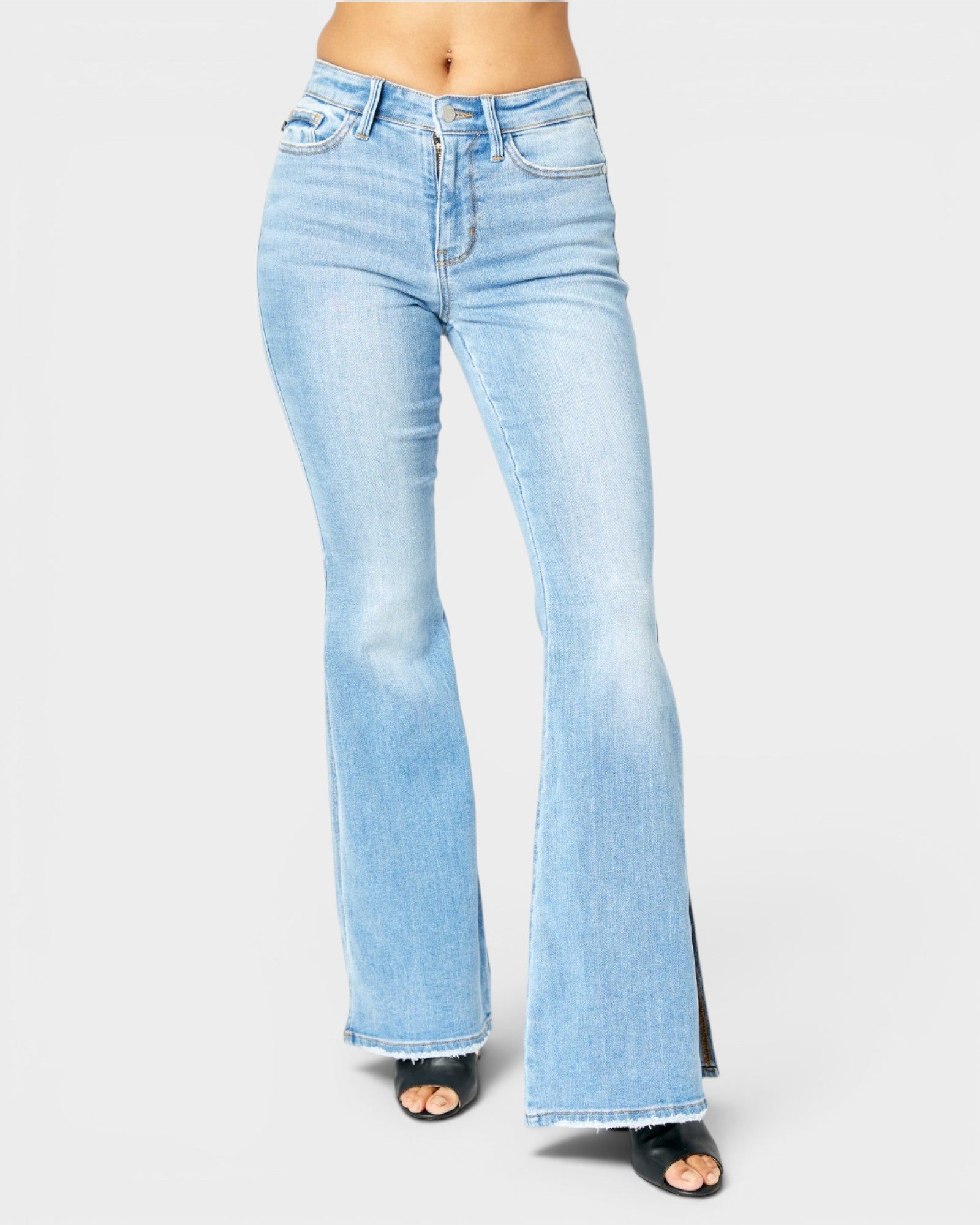 Light blue flared jeans on a white background