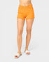 Person wearing bright orange shorts on a white background