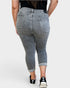 Person wearing gray jeans on a white background